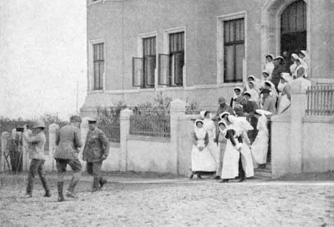 Before the Advance. General Botha photographed with the Red Cross Sisters